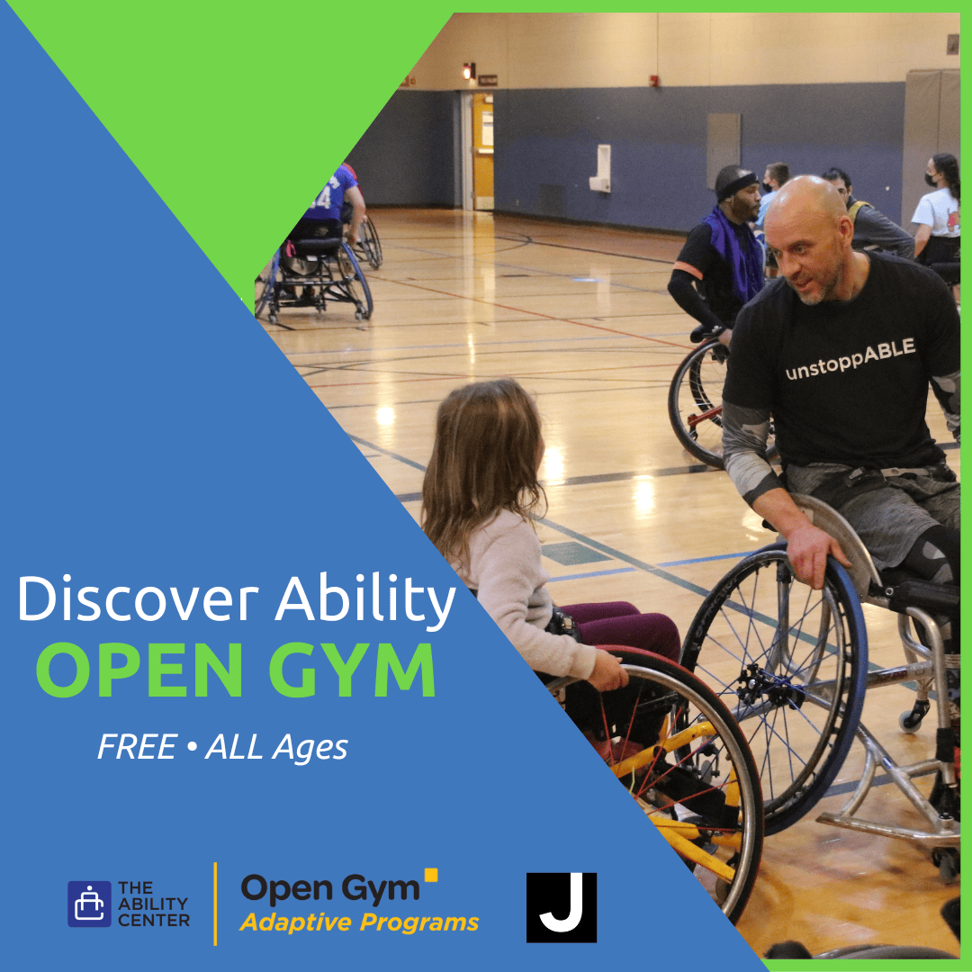 People in wheelchairs participating in an open gym event in a large indoor court.